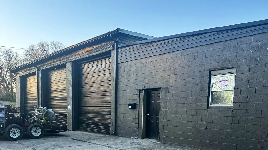 The Transpecialists of Hickory shop building with three roll-up bay doors.