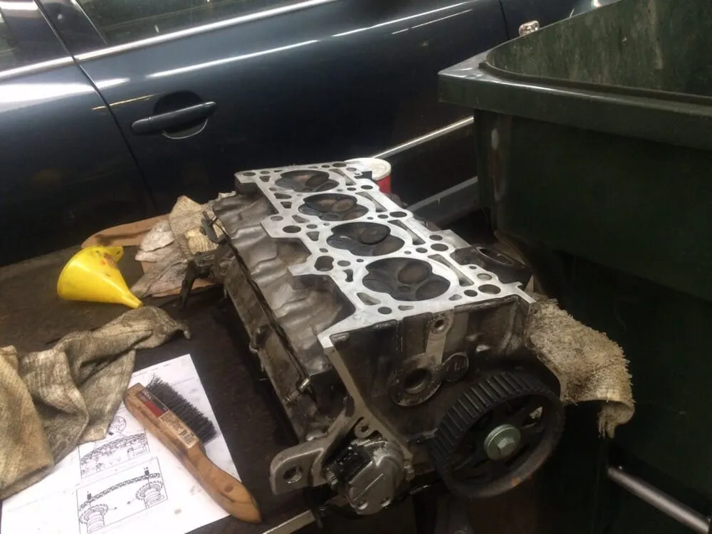 A transaxle case split open on the bench during an overhaul.